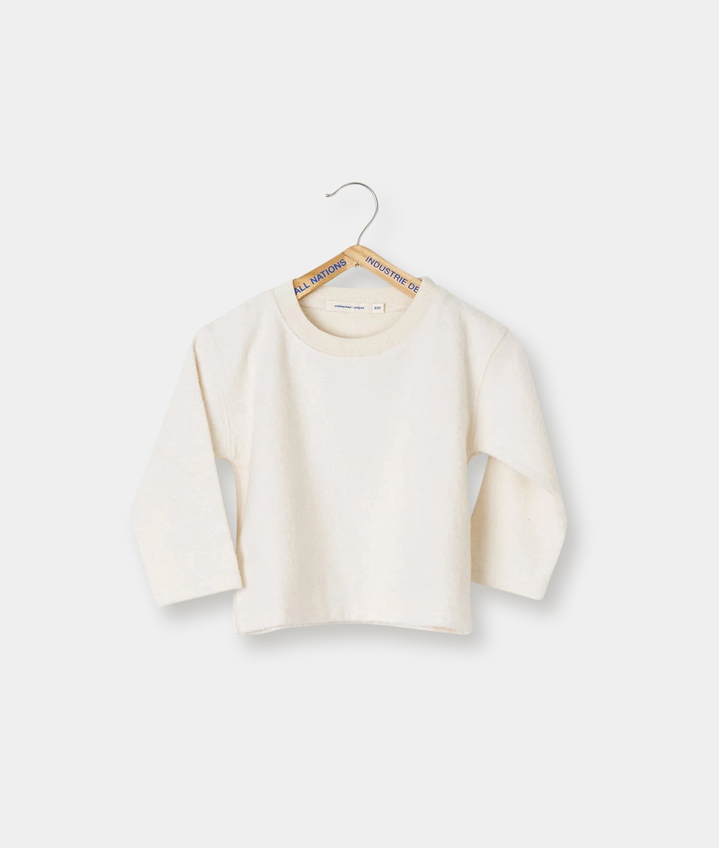 Beige crew neck sweater displayed on a white hanger - Industry of All Nations