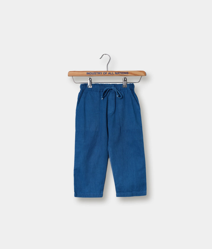 Blue linen drawstring pants displayed on a wooden hanger with "Industry of All Nations" text - Industry of All Nations