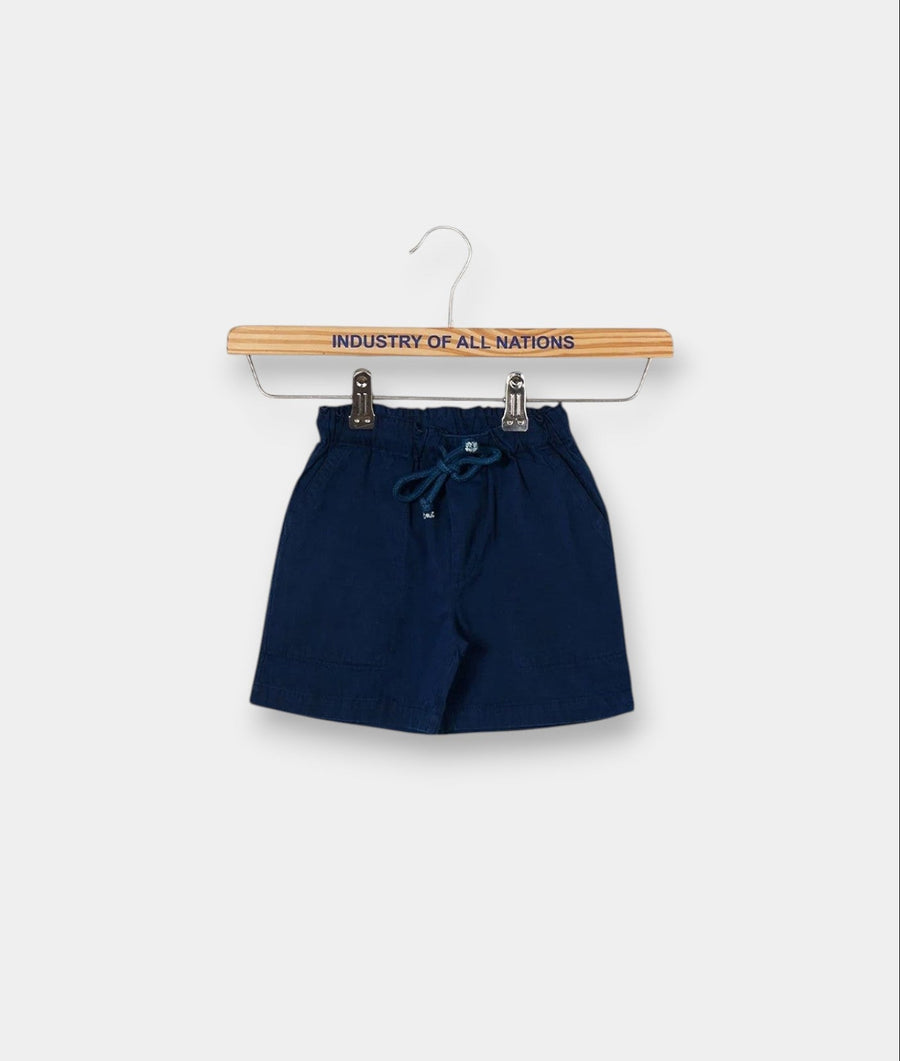 Navy blue drawstring shorts hanging on a wooden hanger with "Industry of All Nations" text - Industry of All Nations
