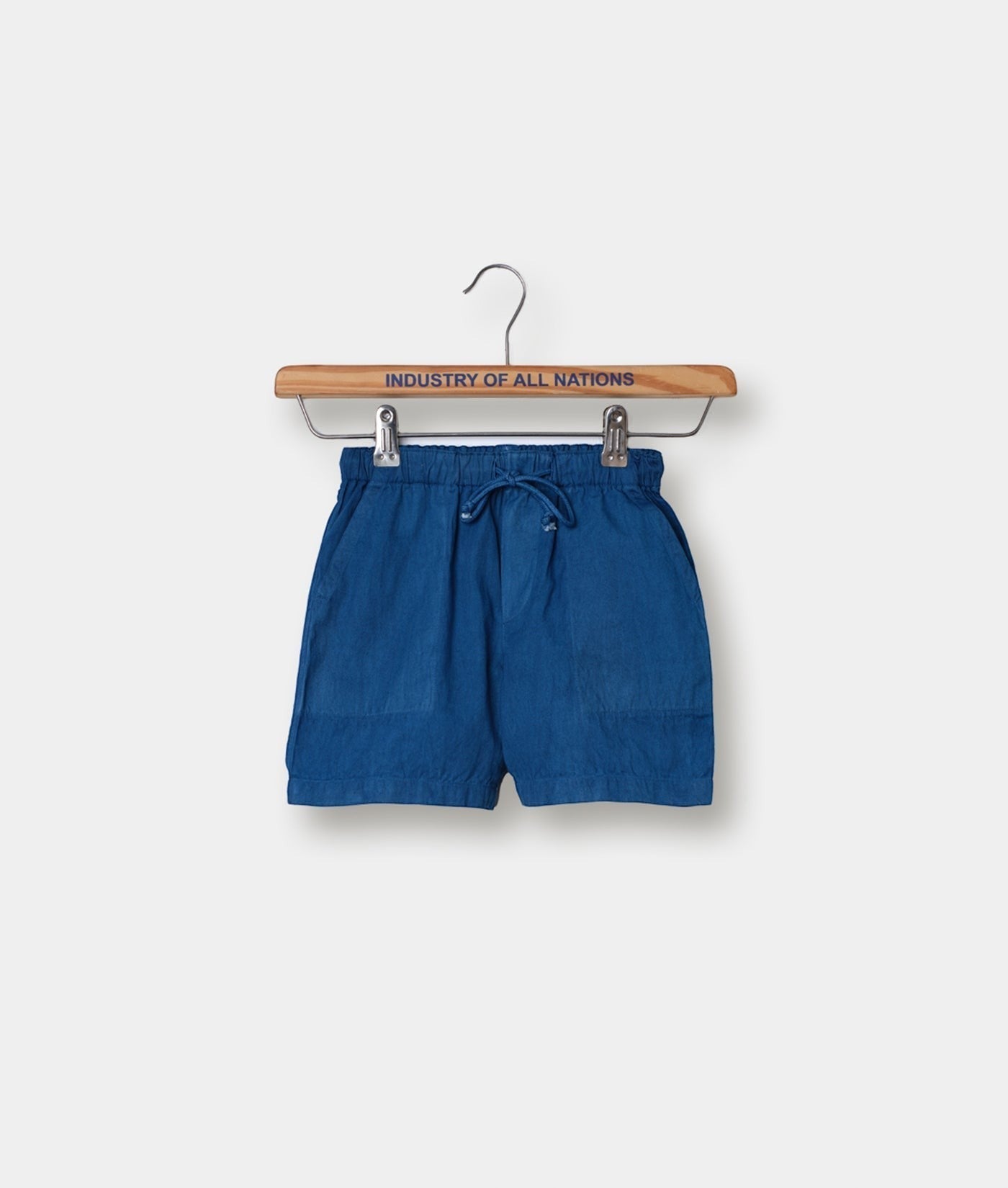 Blue drawstring shorts on wooden hanger with "Industry of All Nations" text - Industry of All Nations