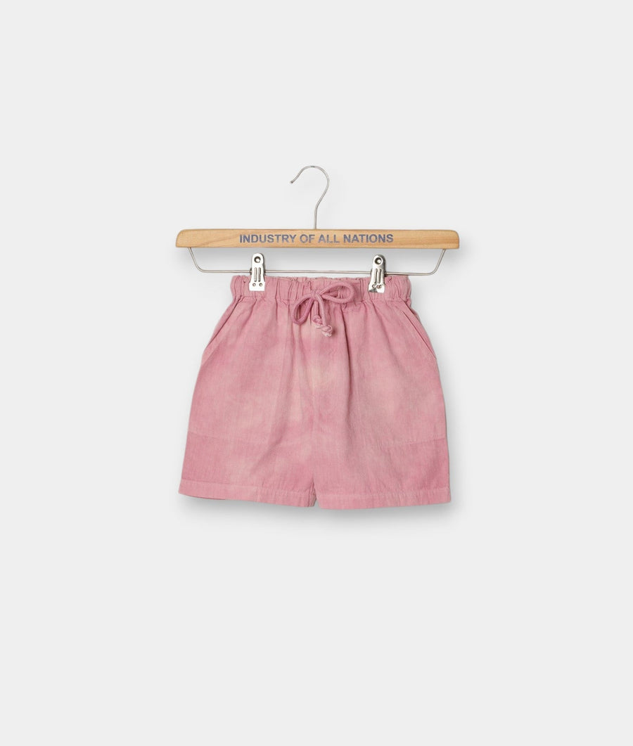 A pink, loose-fitting, drawstring shorts displayed on a branded wooden hanger - Industry of All Nations
