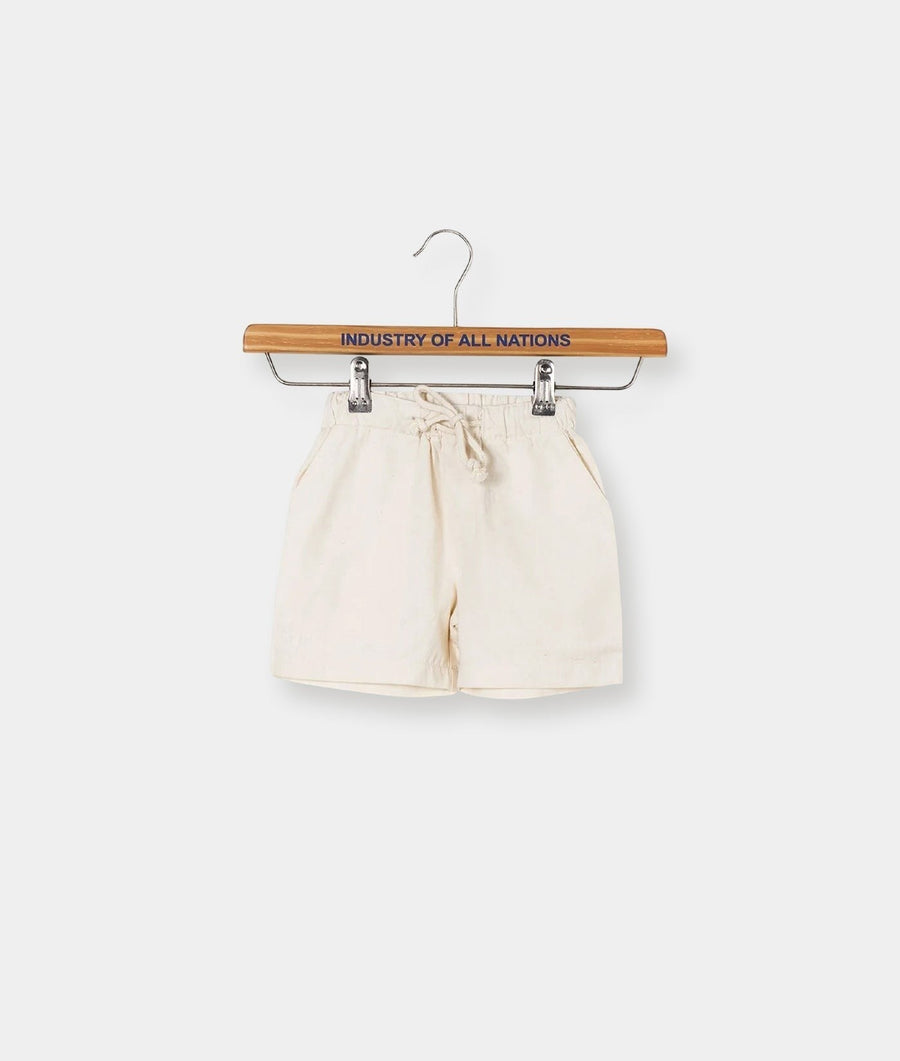 White cotton shorts displayed on a wooden hanger with the text "Industry of All Nations" - Industry of All Nations