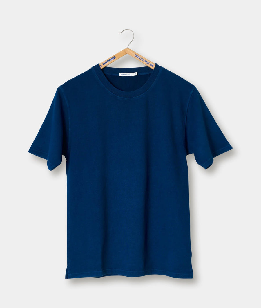 Navy blue cotton t-shirt hanging on a wooden hanger - Industry of All Nations