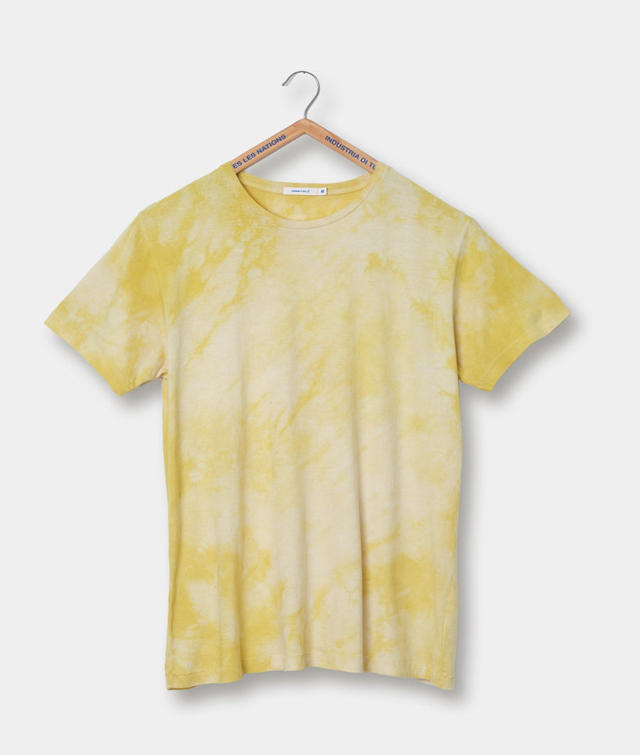 A yellow tie-dye t-shirt on a hanger with the 'Industry of All Nations' brand tag - Industry of All Nations