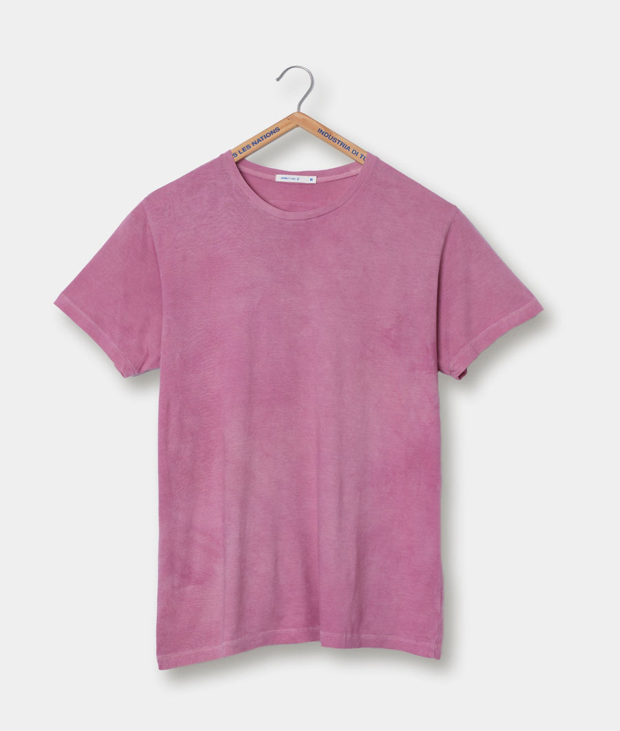 A pink crew neck t-shirt displayed hanging on a wooden hanger - Industry of All Nations