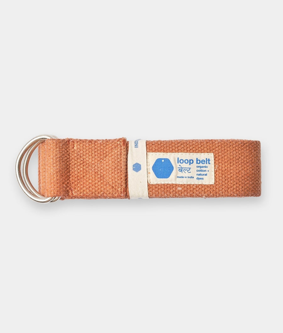 Flat lay image of a rust-colored organic cotton loop belt with metal rings - Industry of All Nations