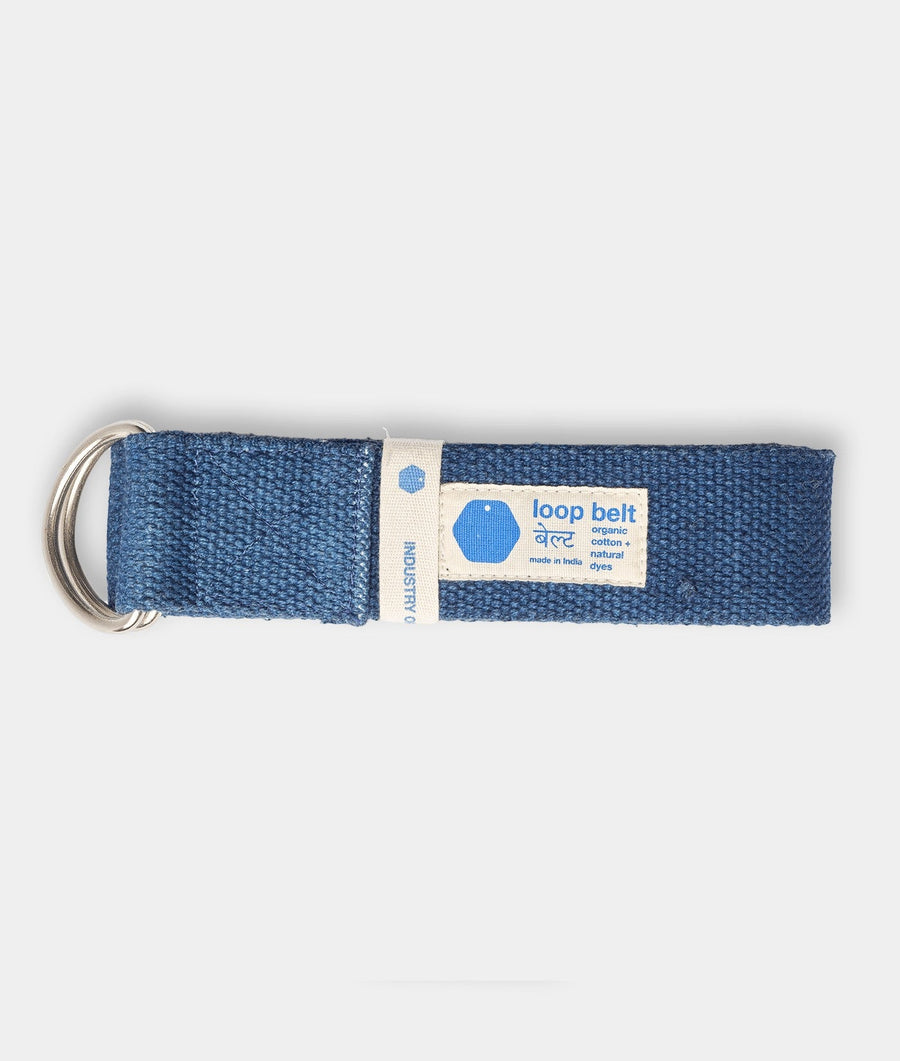A navy blue fabric loop belt with a sewn-on label reading "loop belt organic cotton + natural dyes made in India" - Industry of All Nations