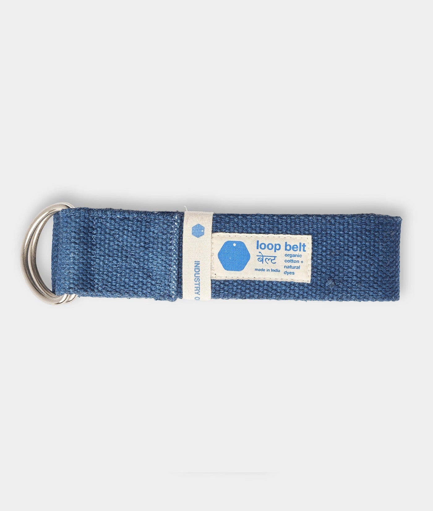 A navy blue fabric loop belt with a sewn-on label reading "loop belt organic cotton + natural dyes made in India" - Industry of All Nations