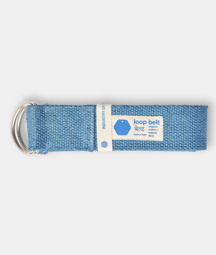 A blue organic cotton loop belt displayed on a flat surface - Industry of All Nations