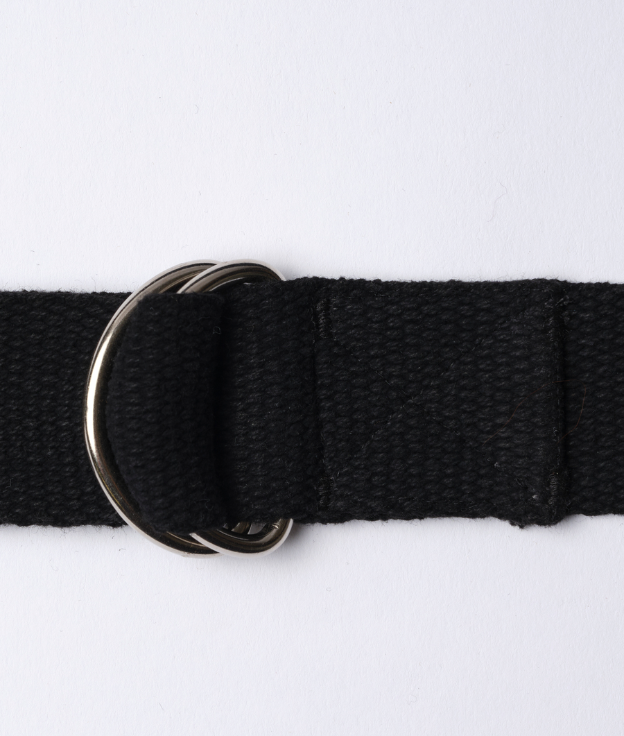 Close-up view of a black cotton belt with double ring metal buckle - Industry of All Nations