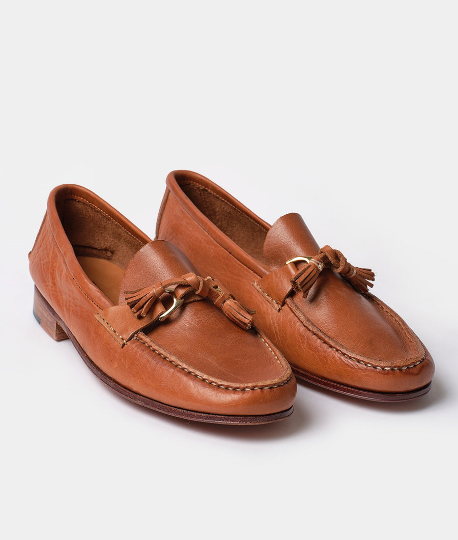 A pair of brown leather tassel loafers displayed on a plain white background - Industry of All Nations