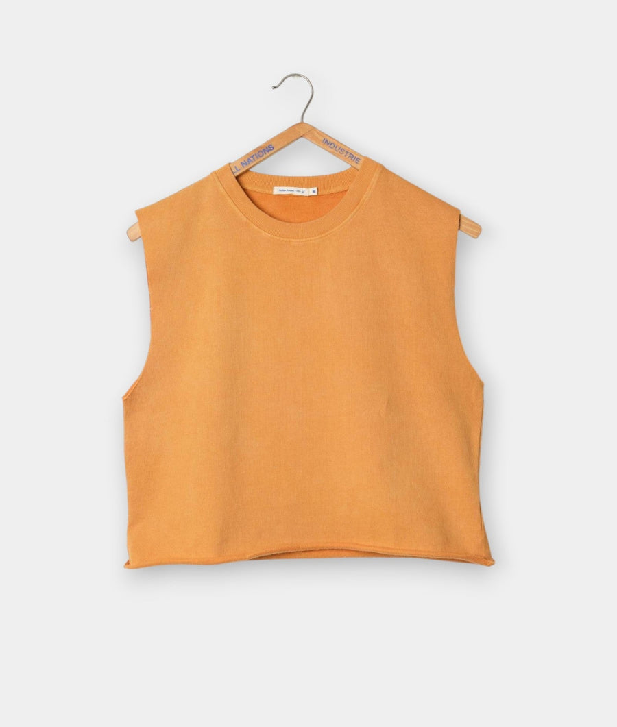 Sleeveless orange cotton top hanging on a wooden hanger - Industry of All Nations