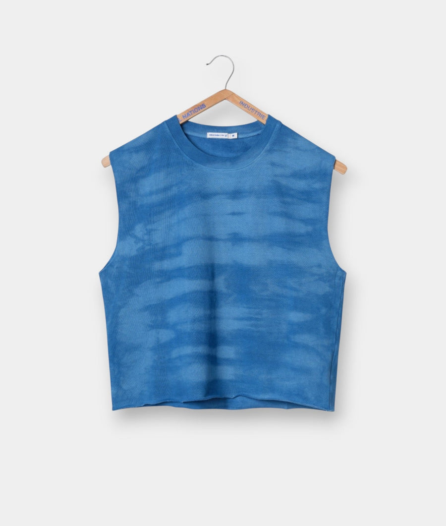 Blue tie-dye sleeveless top hanging on wooden hanger - Industry of All Nations