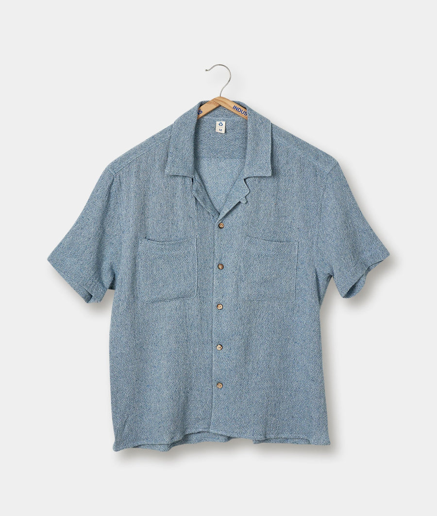 A gray wool short-sleeved shirt displayed on a hanger - Industry of All Nations