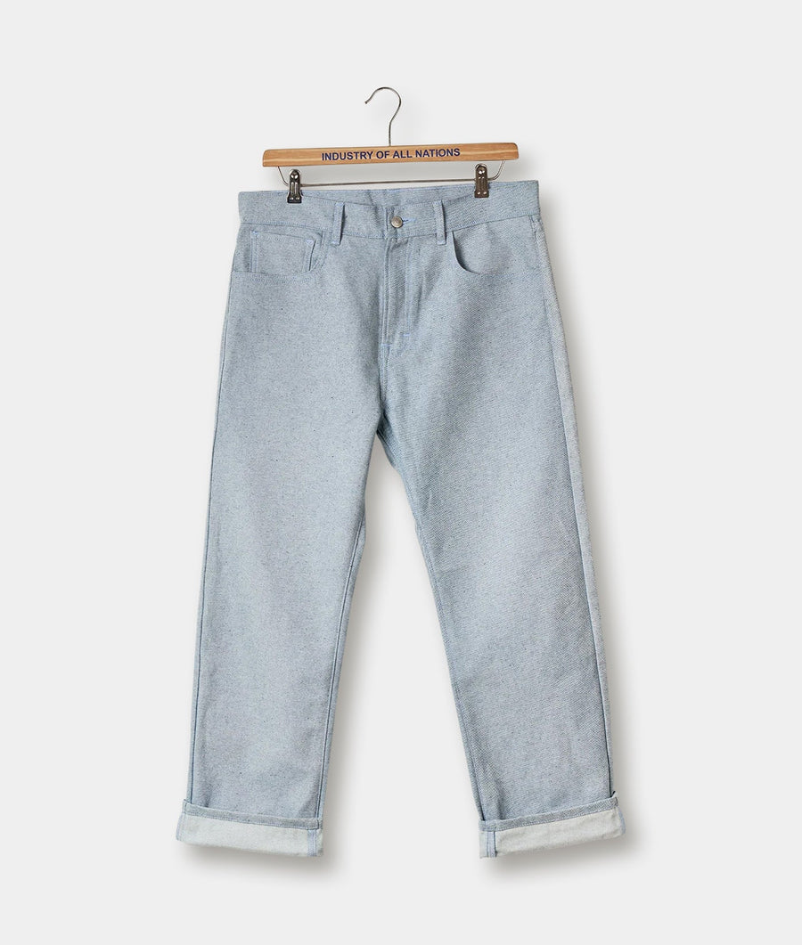 Gray cotton trousers displayed on a wooden hanger with the brand name "Industry of All Nations" visible - Industry of All Nations