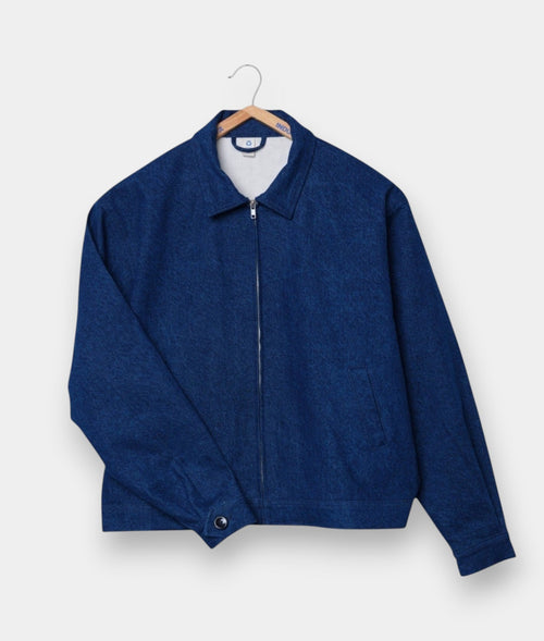 Navy blue zip-up sweater/jacket with collar, displayed on a wooden hanger against a white background - Industry of All Nations