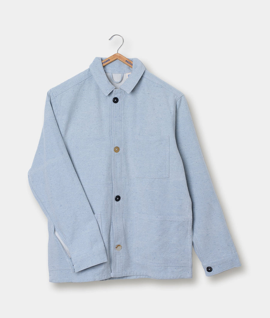 A gray wool/cotton blend jacket with a collared neck and wooden buttons, hanging on a wooden hanger - Industry of All Nations