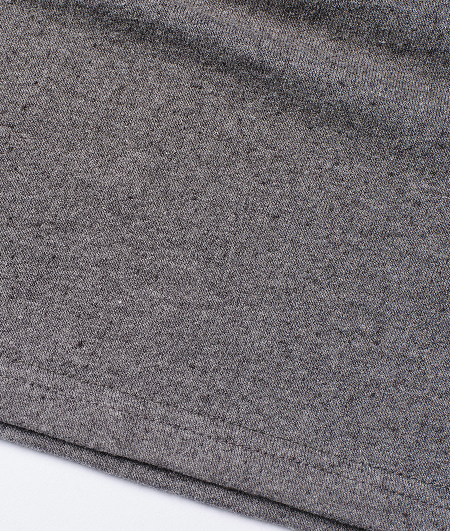 Gray knit fabric in a close-up detail shot displaying the texture - Industry of All Nations