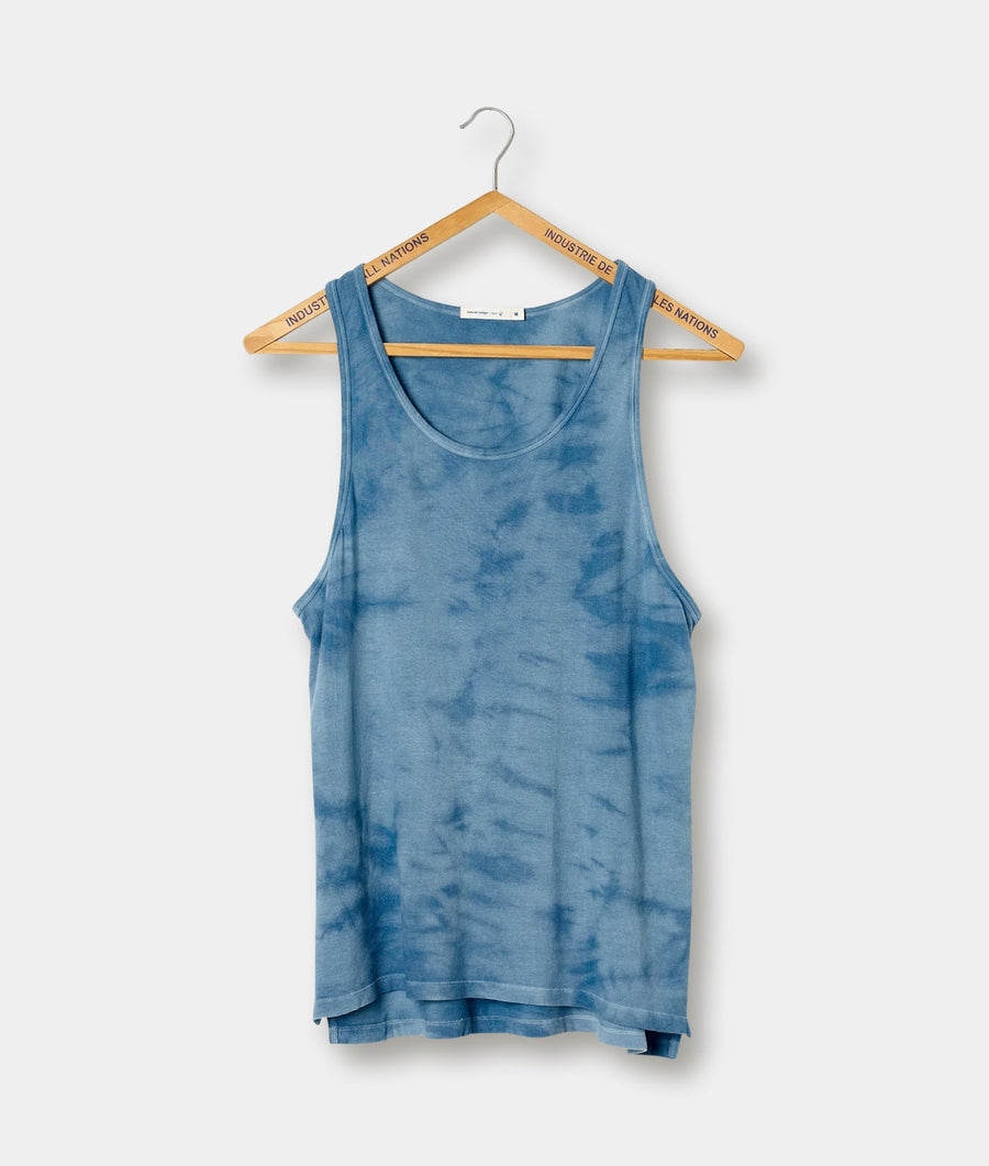 Blue tie-dye tank top, displayed on a wooden hanger - Industry of All Nations