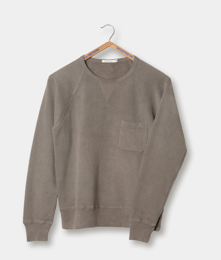 Gray cotton sweatshirt with chest pocket displayed on hanger - Industry of All Nations