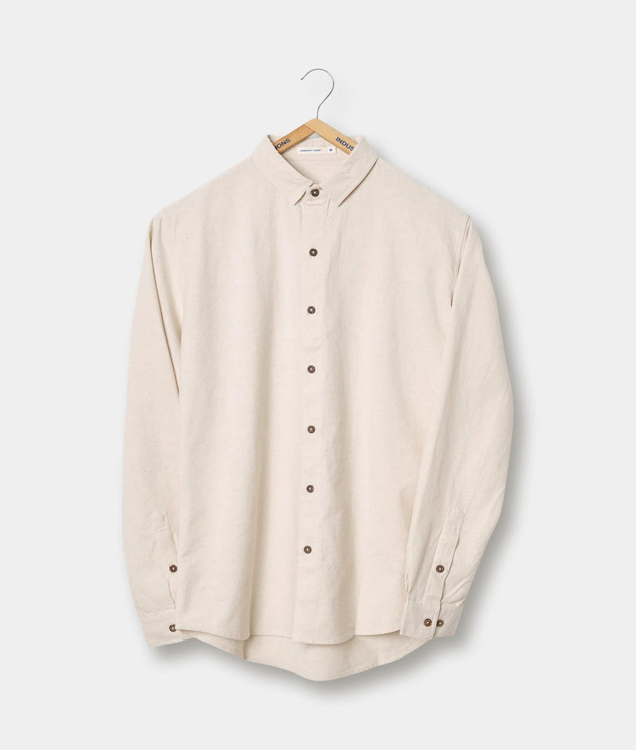 Beige button-down shirt displayed on a hanger - Industry of All Nations