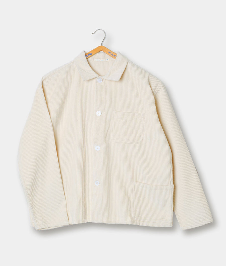 A beige corduroy button-up jacket hanging on a hanger - Industry of All Nations