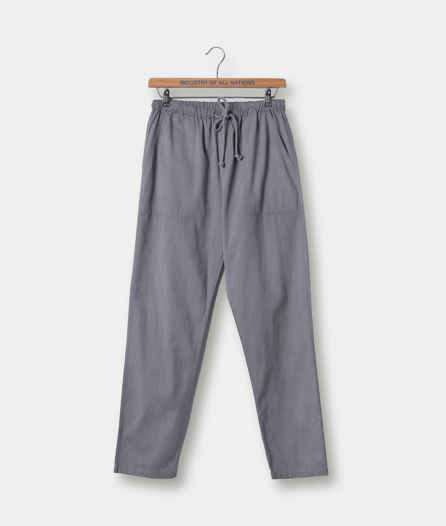 Gray drawstring waist cotton pants displayed on a wooden hanger with "Industry of All Nations" text - Industry of All Nations