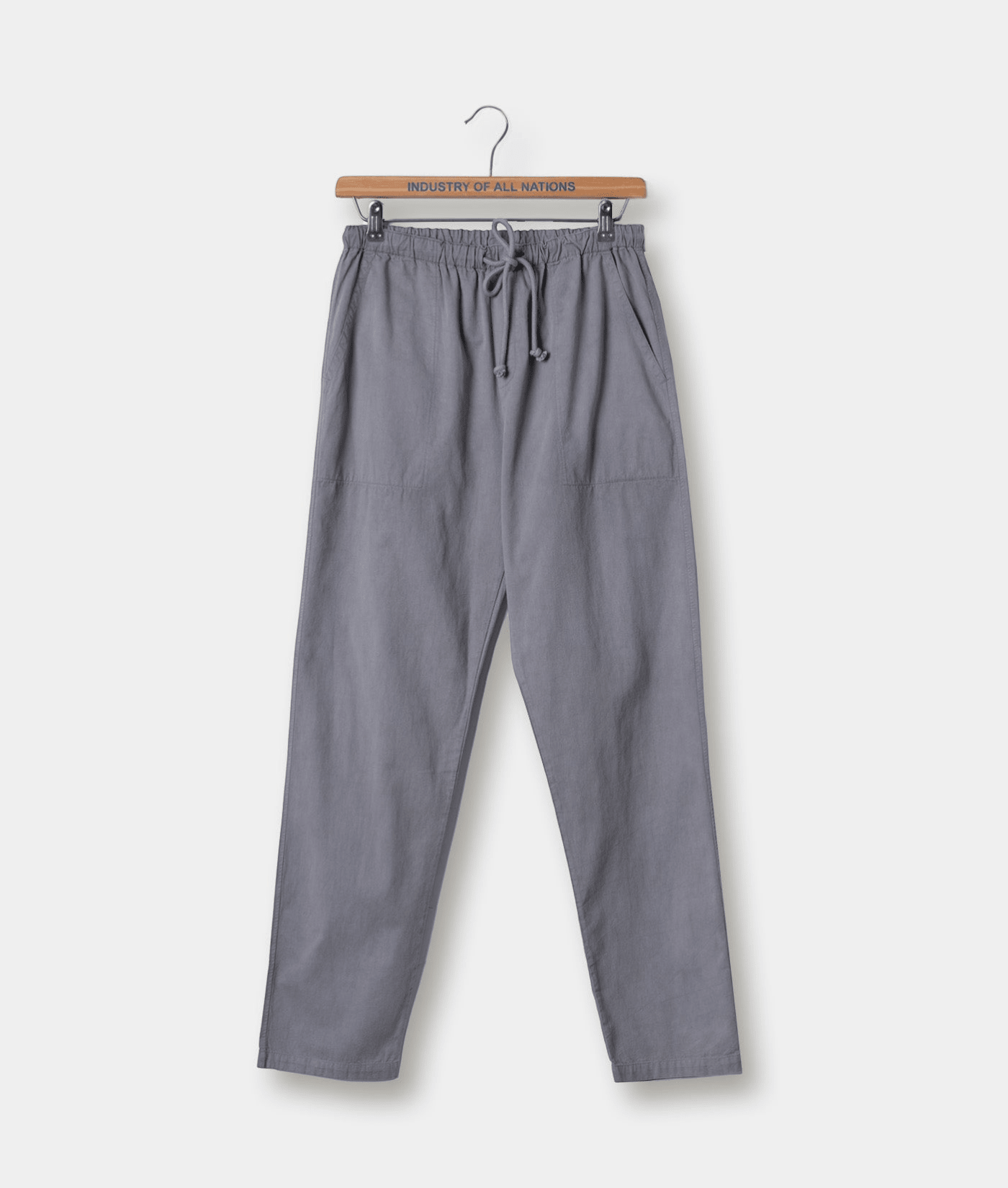 Gray drawstring waist cotton pants displayed on a wooden hanger with "Industry of All Nations" text - Industry of All Nations