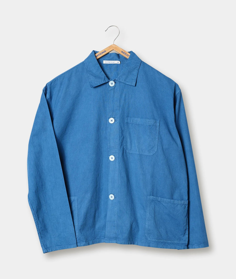 A blue cotton work jacket displayed on a hanger against a white background - Industry of All Nations
