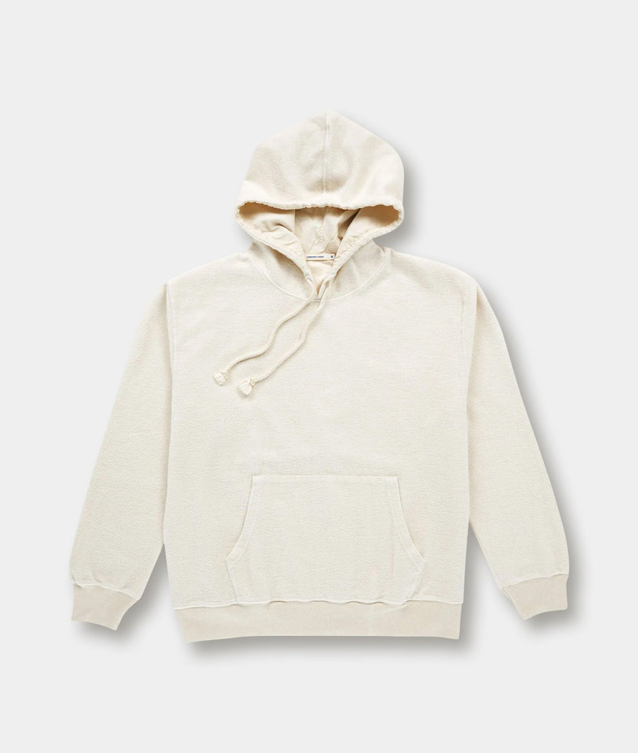 A cream-colored pullover hoodie made of organic cotton, displayed on a plain background - Industry of All Nations.