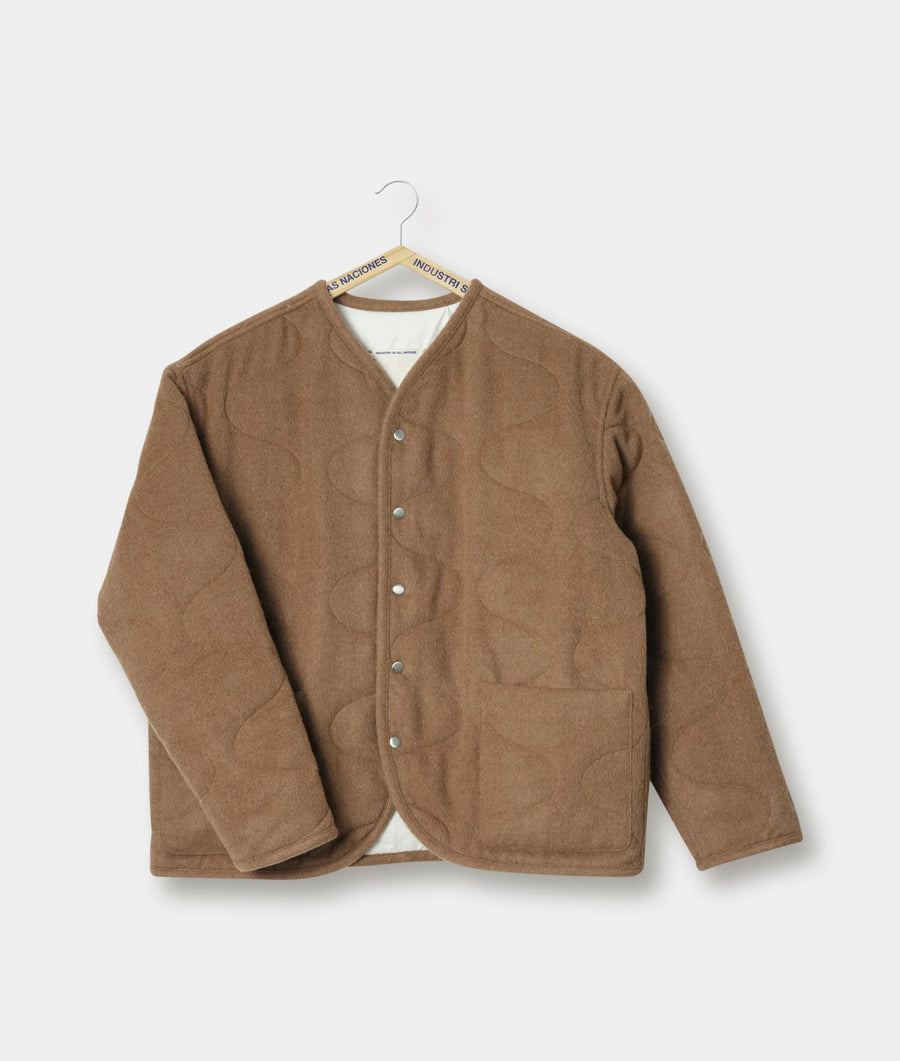Tan wool jacket with button closure, displayed on a hanger - Industry of All Nations