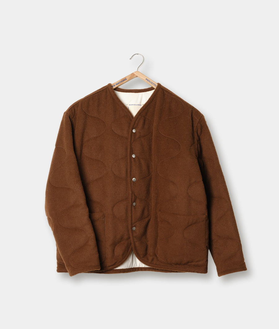 Brown button-up jacket on a hanger - Industry of All Nations