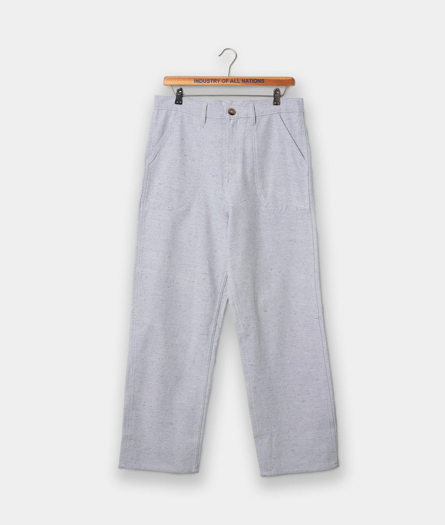 Gray men's trousers on a wooden hanger with "Industry of All Nations" branding - Industry of All Nations