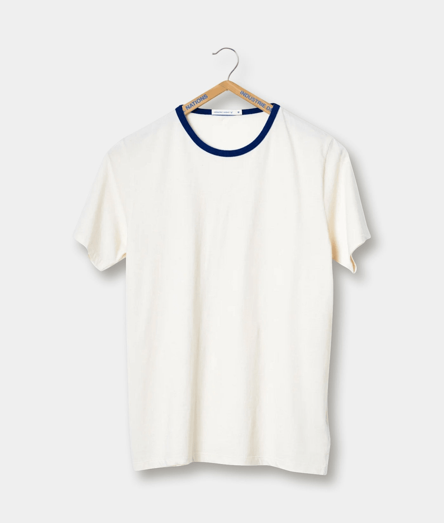 A white t-shirt with navy blue trim, displayed on a hanger against a plain white background - Industry of All Nations
