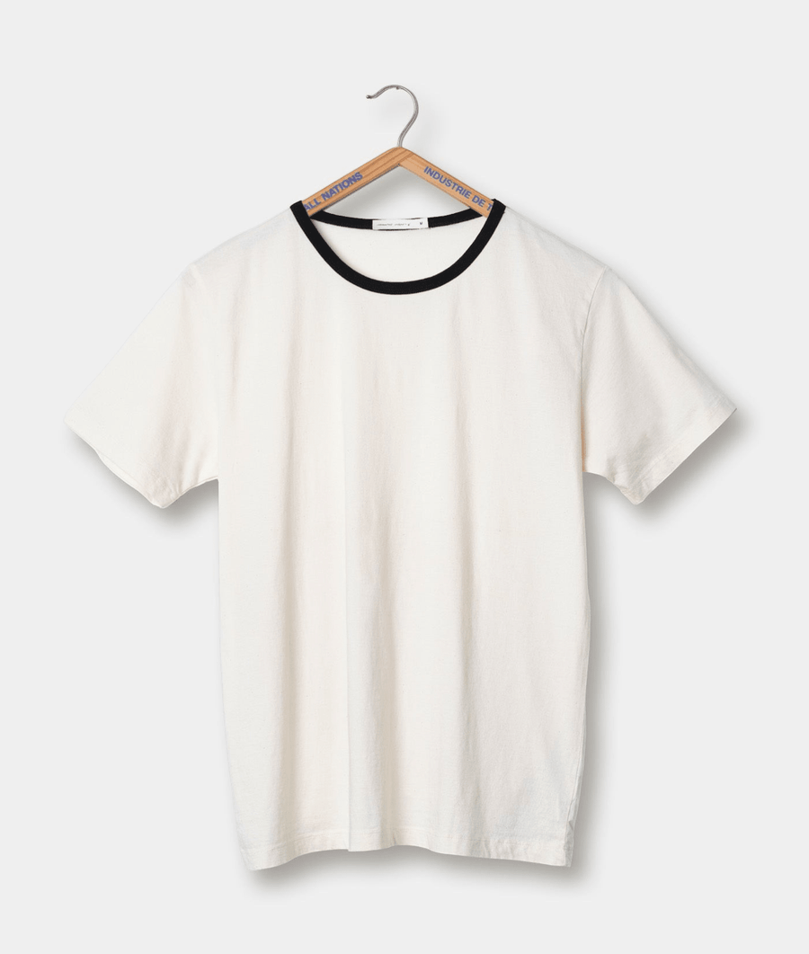 White short-sleeved t-shirt on wooden hanger with Industry of All Nations branding - Industry of All Nations
