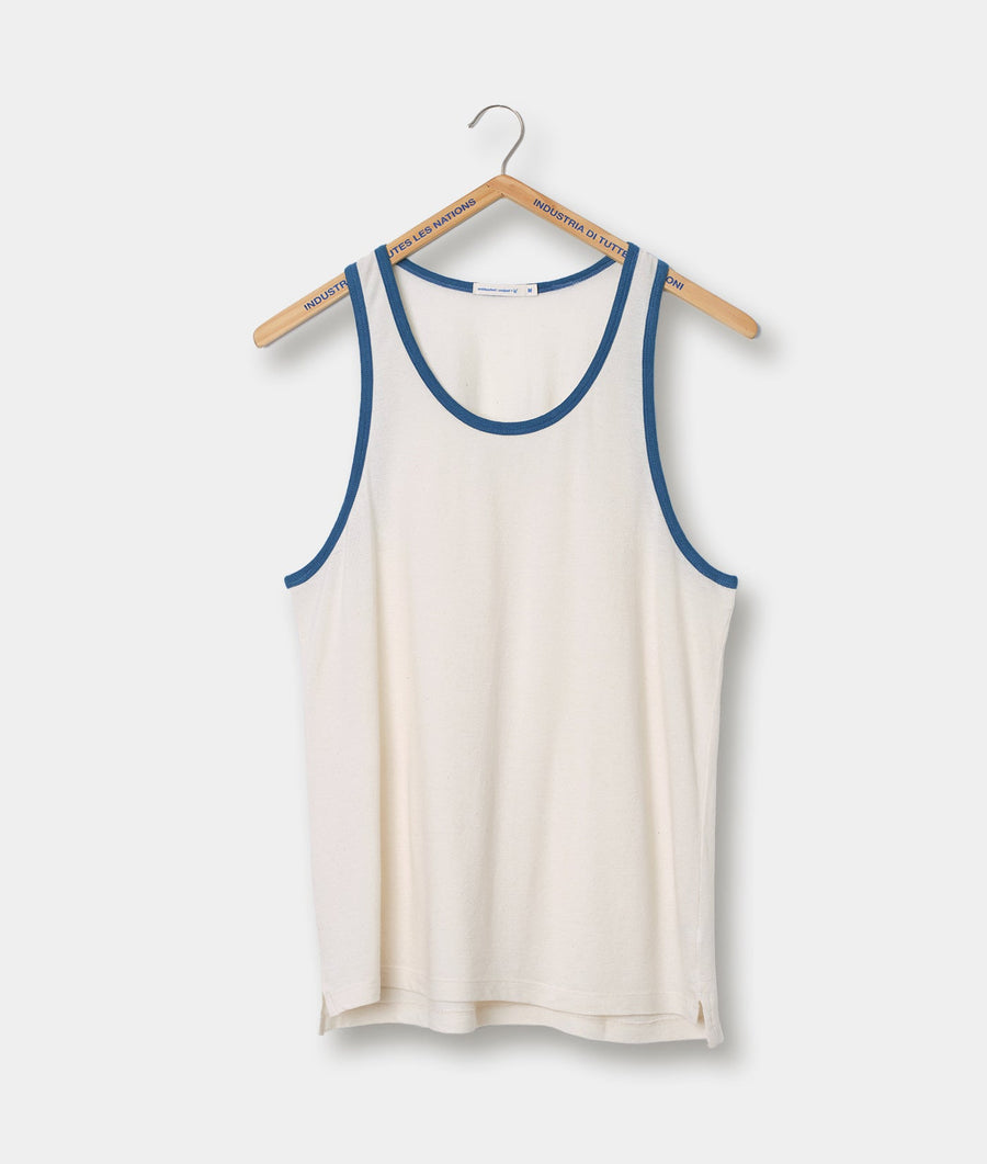 White tank top with navy blue trim and Industry of All Nations branding on the hanger - Industry of All Nations