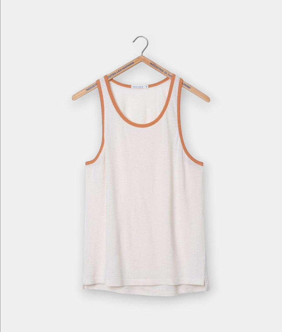 A white tank top with orange trim, displayed on a wooden hanger - Industry of All Nations