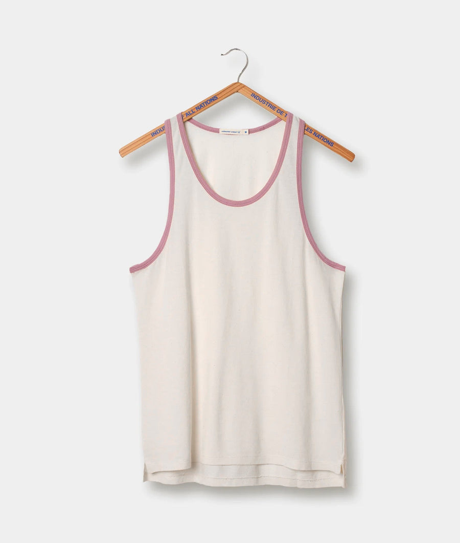 White tank top with pink trim displayed on wooden hanger - Industry of All Nations