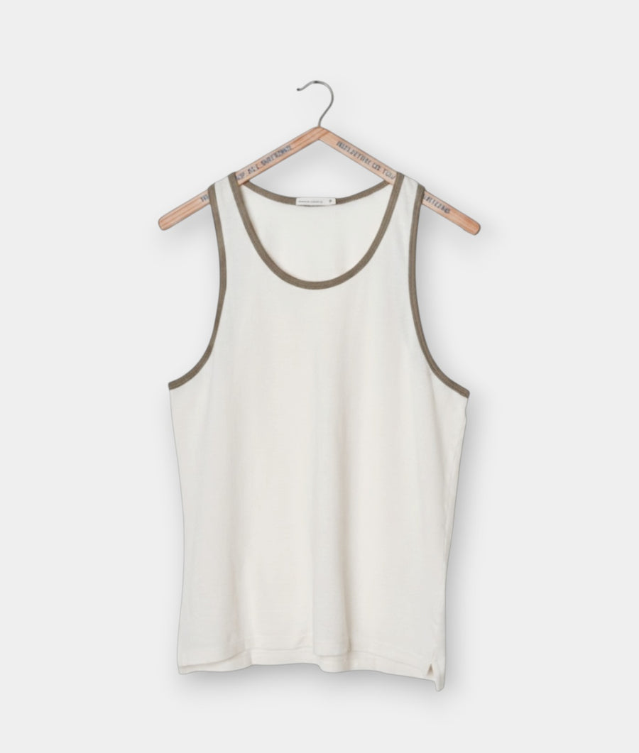 Industry of All Nations cream organic cotton pique tank top with olive green trim on neckline and armholes.