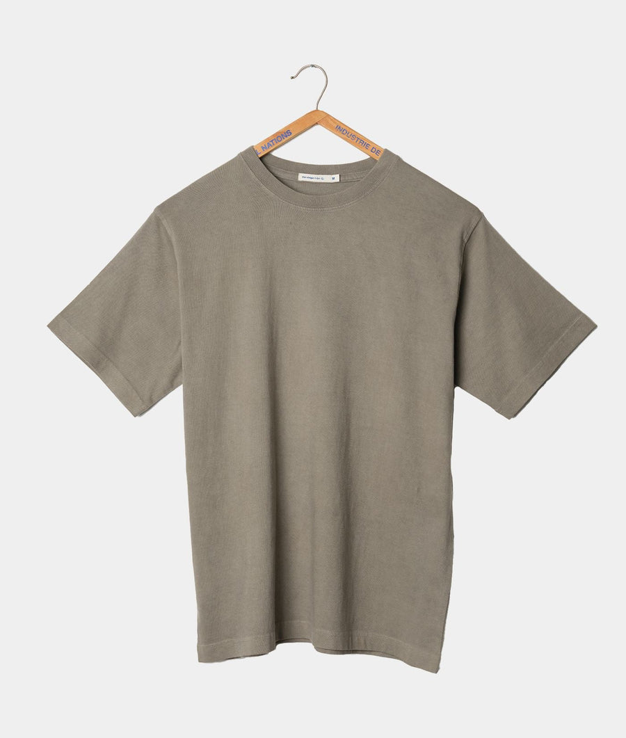 A gray t-shirt hanging on a wooden hanger displaying the "Industry of All Nations" branding - Industry of All Nations