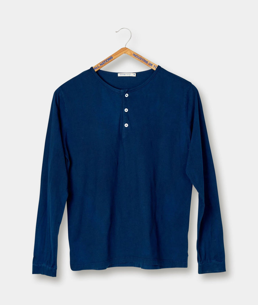Navy blue long sleeve cotton Henley shirt hanging on a wooden hanger - Industry of All Nations