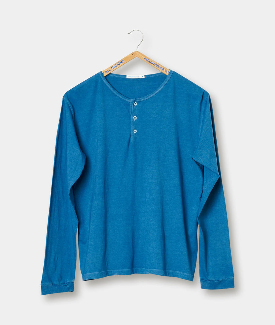 Blue long sleeve organic cotton henley shirt displayed on a wooden hanger - Industry of All Nations