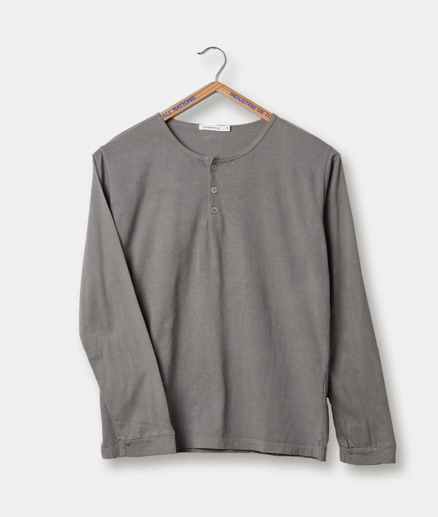 Grey cotton long-sleeve henley shirt hanging on a wooden hanger with "All Nations" text - Industry of All Nations