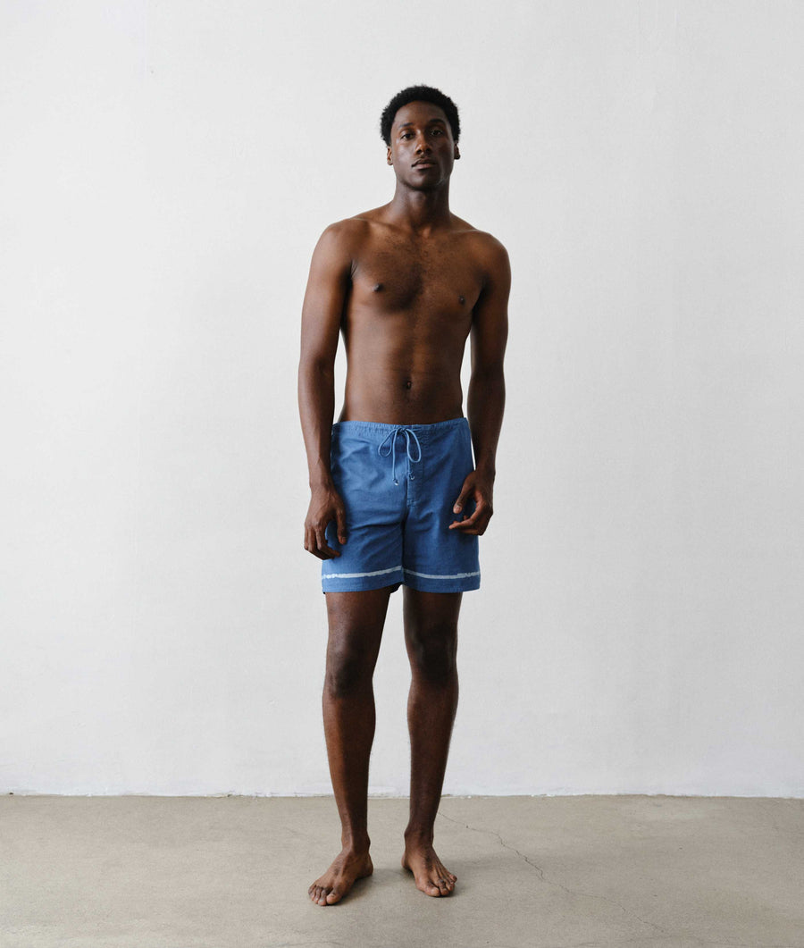 Man wearing IOAN Clean Boardshorts in Batik Linea