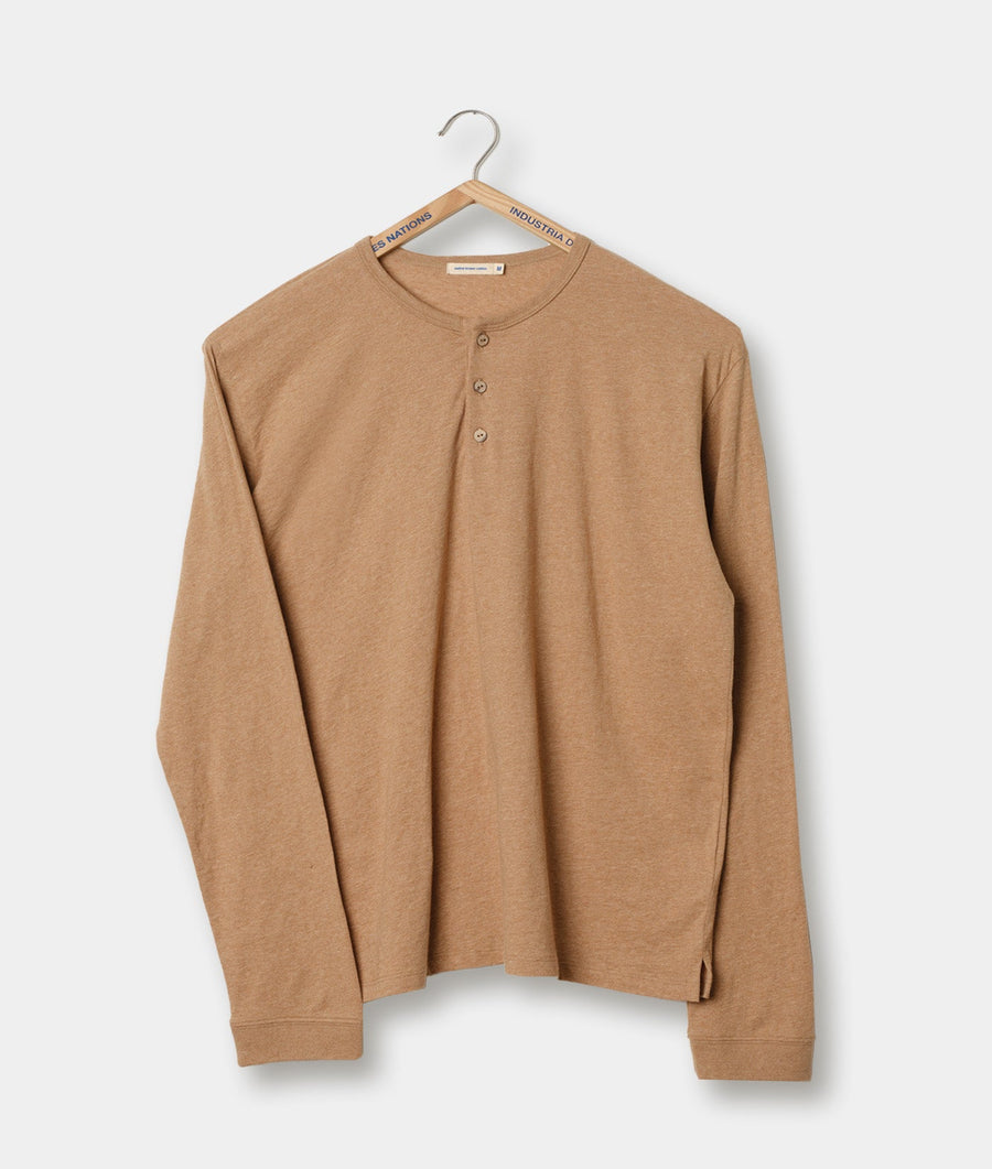 Tan colored cotton knit henley shirt hanging on a wooden hanger - Industry of All Nations