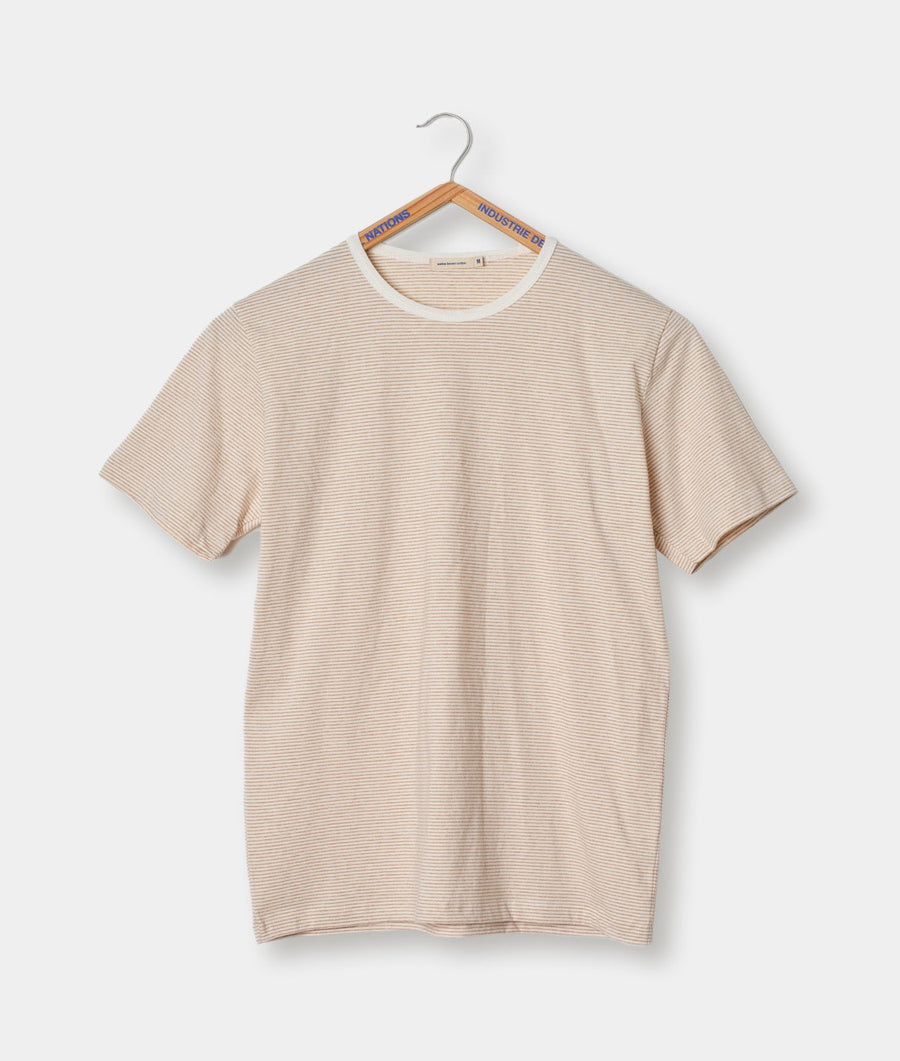 Beige striped t-shirt hanging on a hanger with "Industrie du" label - Industry of All Nations