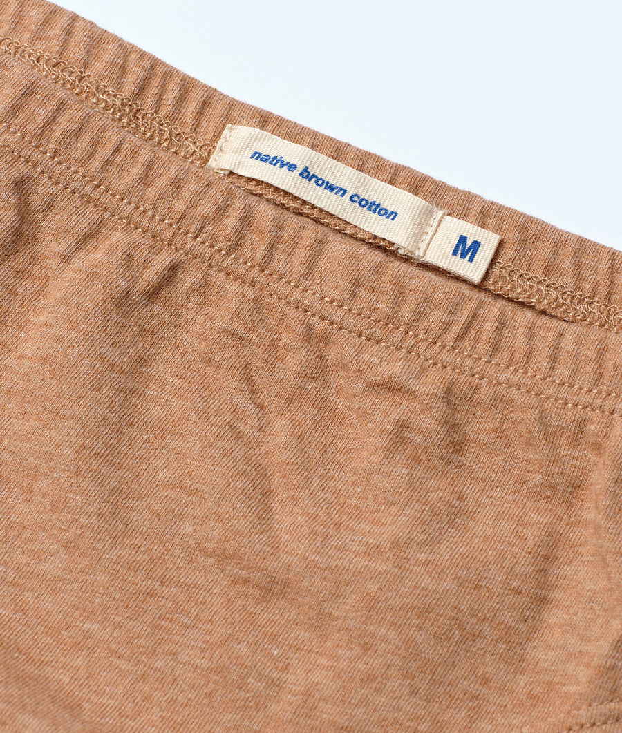 Detail shot of a brown, native-grown cotton T-shirt, size M, with 'native brown cotton' label - Industry of All Nations
