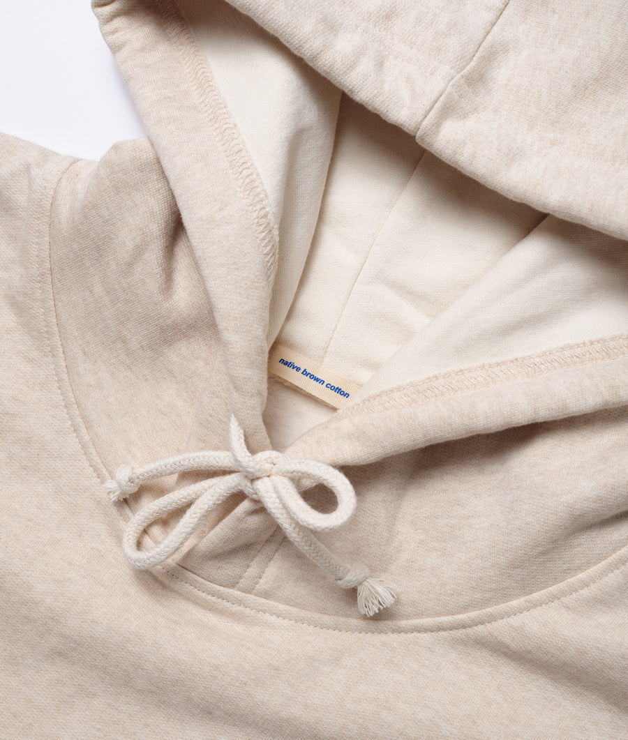 Detail shot of a beige organic cotton robe with a tie closure - Industry of All Nations