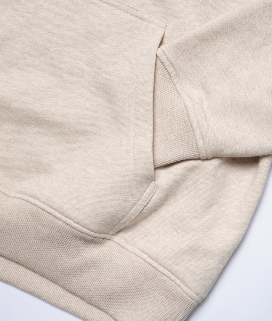 Flat lay detail shot of a beige organic cotton crewneck sweater - Industry of All Nations