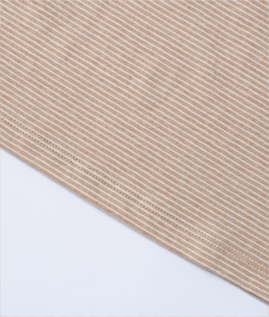 Diagonal striped organic cotton fabric in beige and cream tones, displayed as a flat lay shot - Industry of All Nations